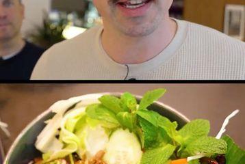 A man with a mustache is speaking, and below is a bowl of salad with greens, herbs, and sliced vegetables.