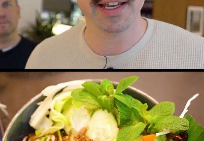 A man with a mustache is speaking, and below is a bowl of salad with greens, herbs, and sliced vegetables.